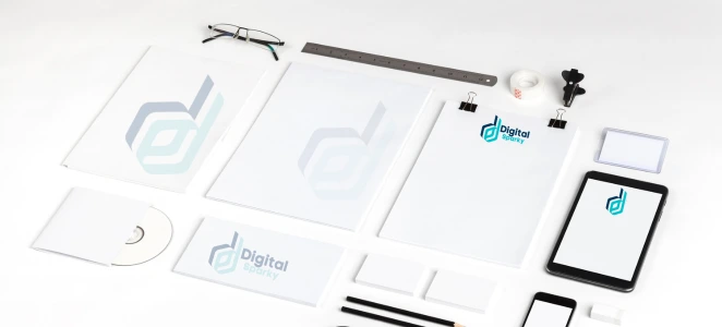 Flat lay of corporate branding materials for Digital Sparky, including letterheads, business cards, a CD, and a mobile phone.