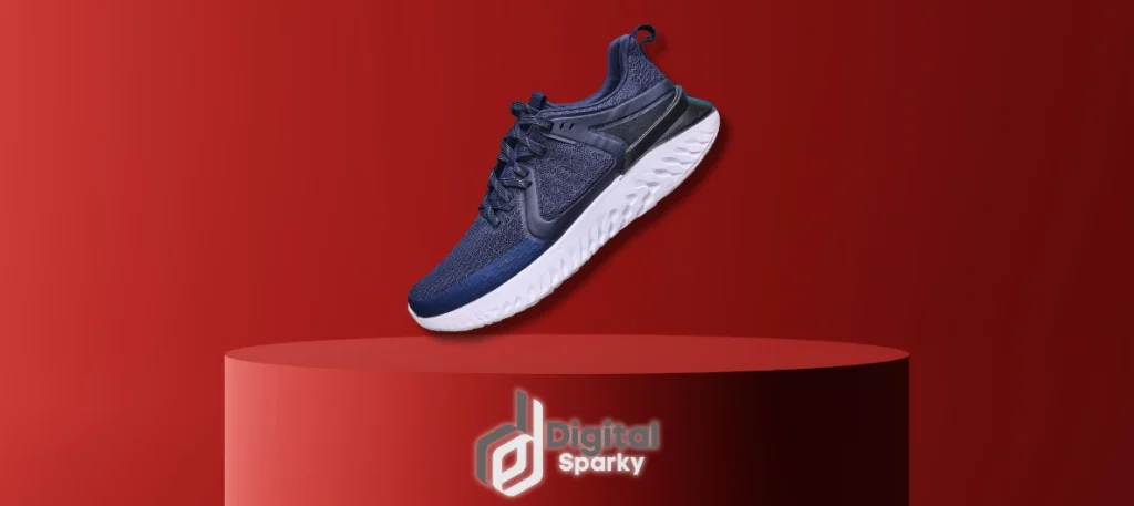 A single dark blue athletic shoe with a white sole hovering above a red cylindrical display pedestal, against a red background, with the Digital Sparky logo.
